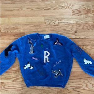 Blue embroidered patch sweater